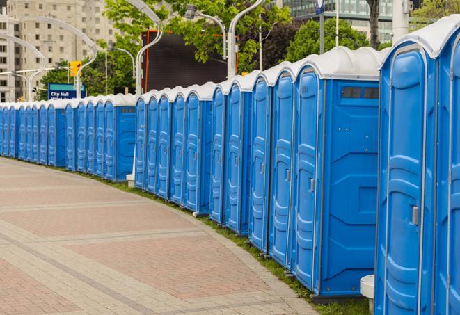 a line of portable restrooms at a sporting event, providing athletes and spectators with clean and accessible facilities in Bauxite, AR